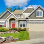 House in a neighborhood with a red entry door