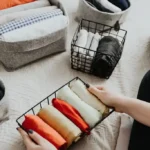 organizing clothes in baskets